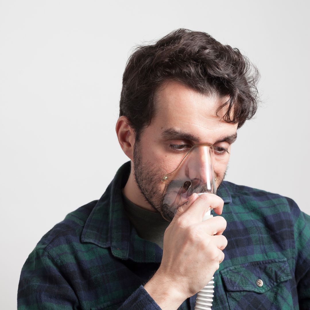 a man wearing an oxygen breathing mask